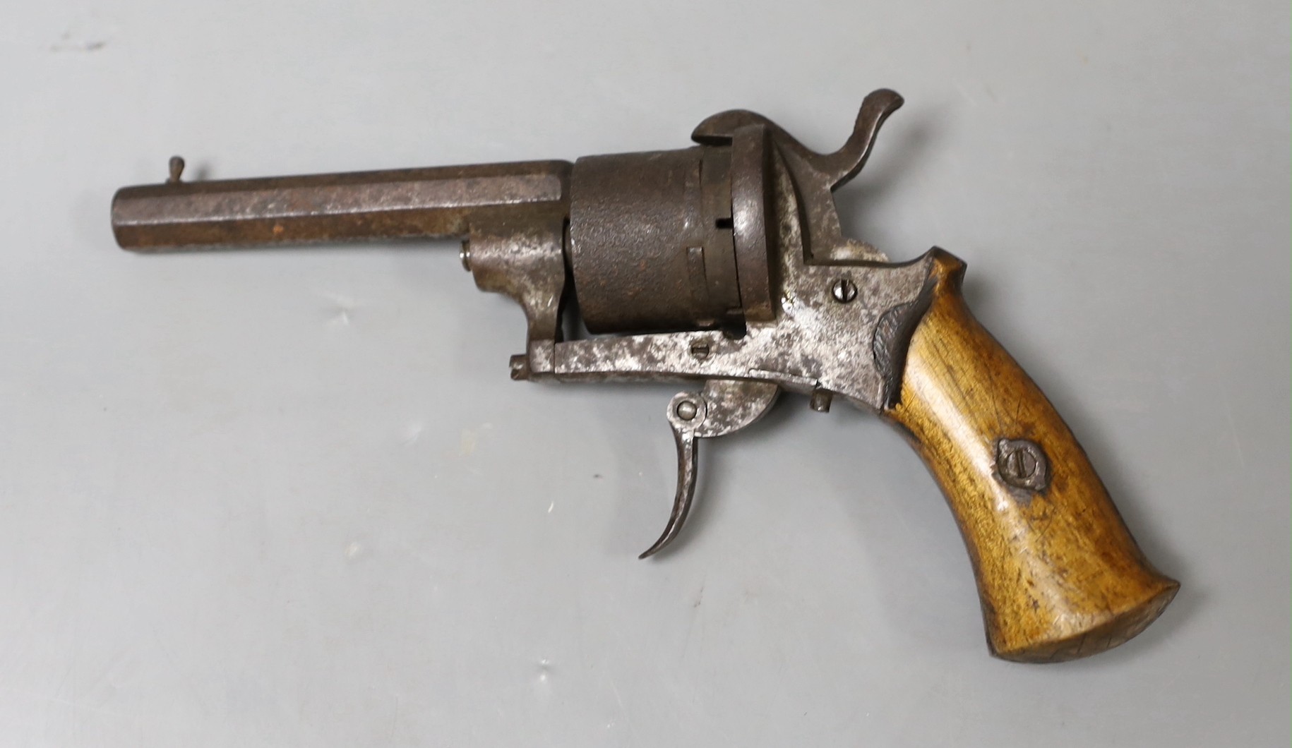 A Belgian 8mm pin fire six shot revolver, hexagonal barrel stamped ‘ELC*’